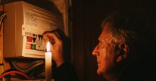 Man checks fuse in fuse box