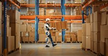 Man holds box while a robot supports him